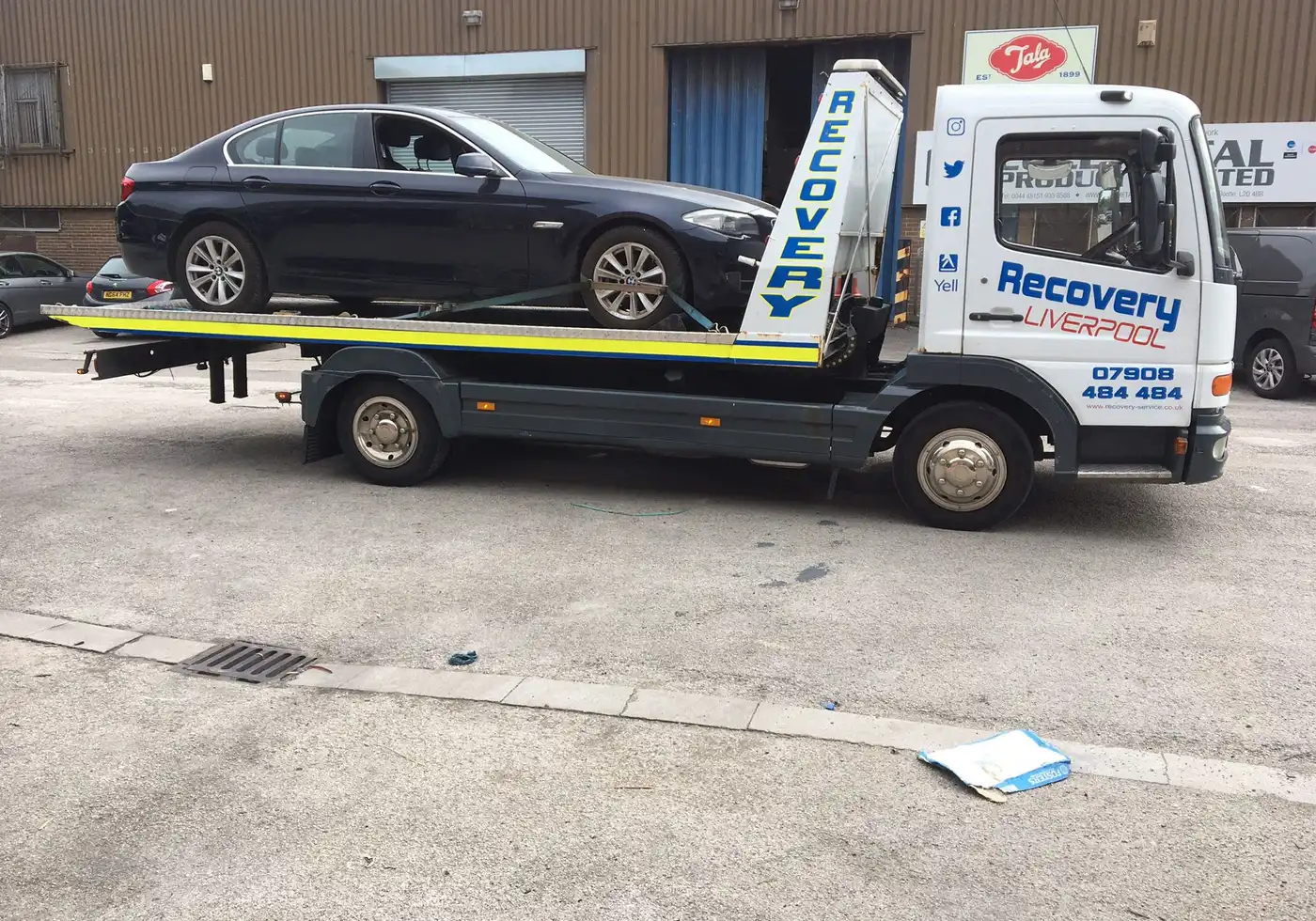 BMW being towed